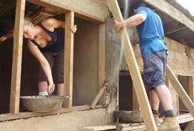 Building Volunteers work on building the framework for a house being constructed in a local community in Ghana.