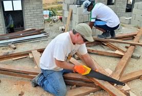 Building Volunteers work on the construction of a new classroom in the Philippines.
