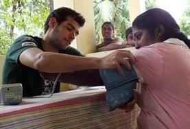 Sri Lanka A Medicine volunteer in Sri Lanka measures a woman's blood pressure as part of a screening outreach over the Christmas holidays.