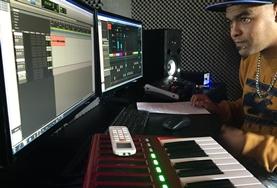 South Africa A Music Production volunteer learns about the electronic equipment involved in producing music at his internship in South Africa.