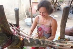 Creative & Performing Arts An Arts & Crafts volunteer learns how to weave using a traditional loom at her placement in Togo.