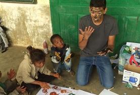 Care A Care & Community volunteer has fun painting with local children in Madagascar over his high school vacation.