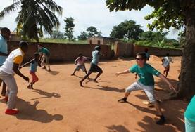 Care High School Project volunteers play a game with local children in Togo to help with their physical development and teamwork.