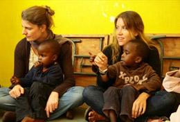 Care High School Project volunteers spend time with local children in Kenya, helping with their education and development.