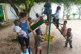 Care A volunteer spends time working with children in a playground at her Care & Community placement in Togo.