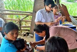 Medicine & Healthcare A high school student assists at a healthcare screening as part of her short-term Public Health internship in the Philippines.