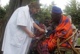 Tanzania A high school student volunteering on our Public Health project in Tanzania measures a local person's blood pressure.