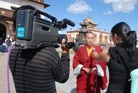 Journalism A Journalism intern interviews a local person for a news station in Mongolia, Asia.