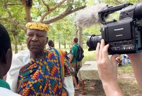 Journalism A Journalism intern conducts an interview with a man for a local news broadcasting company in Togo.