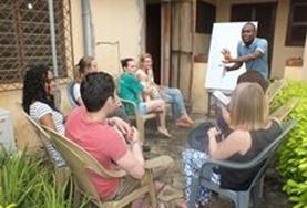Language Courses A group of volunteers in Togo attend a Ewe language class to improve their skills in this local language.