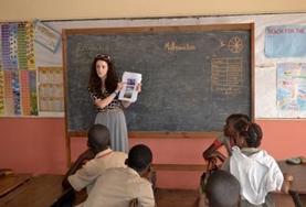 Jamaica A Human Rights volunteer speaks to local children about their rights during an awareness outreach in Jamaica.