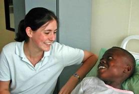 Medicine & Healthcare A Dentistry intern volunteering in Ghana spends time with a patient after a dental procedure.