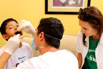 A Dentistry volunteer in Mexico checks a child’s teeth. A child receives a dental check-up from a Dentistry volunteer in Mexico.