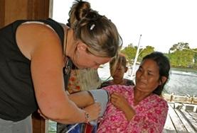 Cambodia A Medicine intern measures a local woman's blood pressure at her volunteer medical placement in Cambodia.