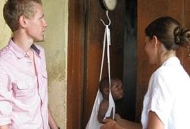 Ghana Medicine interns weigh a baby at our volunteer placement hospital in Ghana.