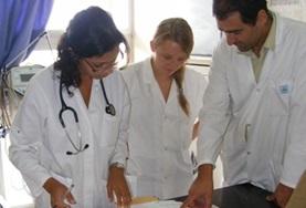 Medicine & Healthcare A local doctor speaks to Medicine interns about a patient's file during their Medical internship in Morocco.