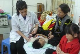 Medicine & Healthcare Medical interns in Vietnam observe as a local doctor treats a patient.