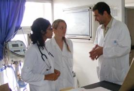 Medicine & Healthcare A professional doctor talks to Midwifery volunteers about the work they will be involved in at their placement in Morocco.