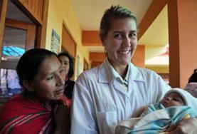 Medicine & Healthcare A Midwifery intern holds a newborn baby at her volunteer placement in Peru.