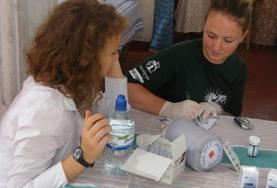 Medicine & Healthcare Midwifery volunteers doing a medical internship in Sri Lanka assist with preparing medication in the maternity department of a hospital.