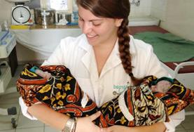 Medicine & Healthcare A Midwifery volunteer holds two newborn babies at her placement in the maternity department of a hospital in Tanzania.