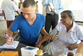Medicine & Healthcare A Nursing volunteer in Sri Lanka conducts basic health checks at a hospital, contributing to his medical experience during his internship.