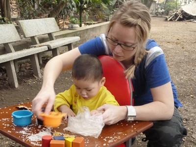 Physio Vietnam Projects Abroad Vietnam volunteer works with children at physiotherapy placement