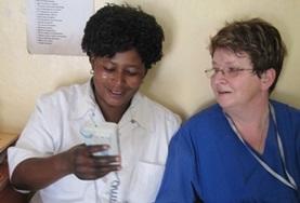 Medicine & Healthcare A Physiotherapy volunteer speaks to a local medical staff member about treatment techniques in Tanzania.