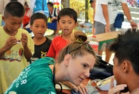 Medicine & Healthcare A Public Health intern assesses a child's health during a volunteer medical outreach in the Philippines.