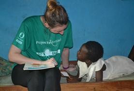 Social Work A Social Work intern works with a local child in Ghana under the guidance of a qualified mental health professional.