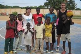 Sports A Sports volunteer poses with a group of children after coaching them and improving their fitness at our Multi-sports placement in Ghana.