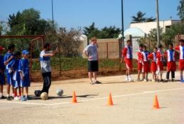 Sports Local school children work on a soccer drill with a volunteer at our Multi-sports placement in Morocco.