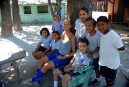 Sports A group of school children relaxes after their sports lesson as part of our volunteer School Sports project in Costa Rica.