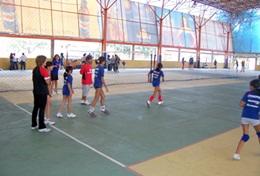 Sports A Sports volunteer coaches a team of volleyball players in Bolivia.