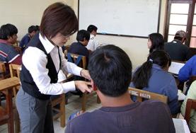 Bolivia A Teaching volunteer gives a one-on-one English lesson to a local student at a school in Bolivia.