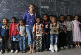 Ethiopia A volunteer stands at the blackboard with her class at our Teaching placement in Ethiopia.