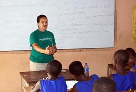Madagascar A Teaching volunteer explains concepts to a classroom of students at a school in Madagascar.
