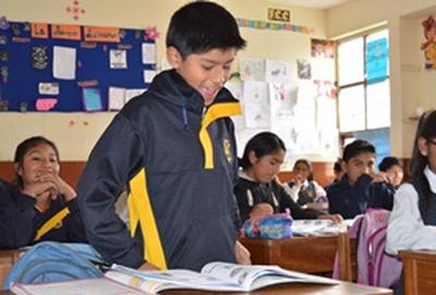 Peru A school child gives his answer during an English class at our volunteer Teaching placement in Peru.