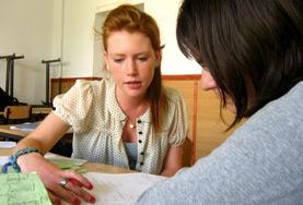 Romania Teaching volunteers in Romania work together on a lesson plan to teach English to children at a local school.