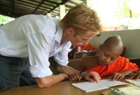 Sri Lanka A volunteer guides a young boy through his English homework at one of our Teaching placements in Sri Lanka.